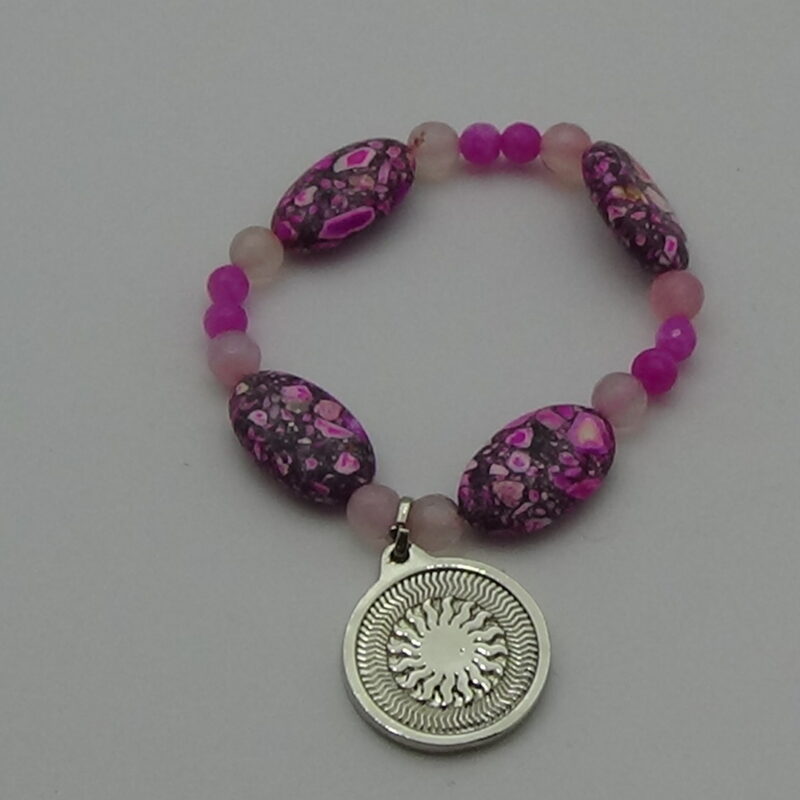 PULSERA DE CUARZO ROSA CON DIJE DEL ENEGRAMA SOLAR DE PLATA