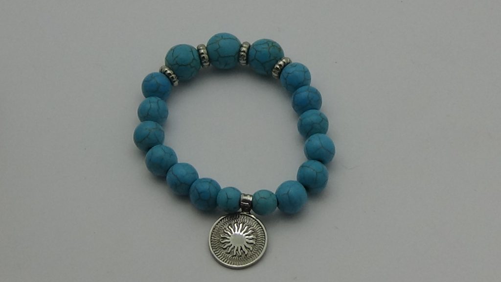 PULSERA DE CUARZO TURQUESA CON DIJE DEL ENEGRAMA SOLAR DE PLATA