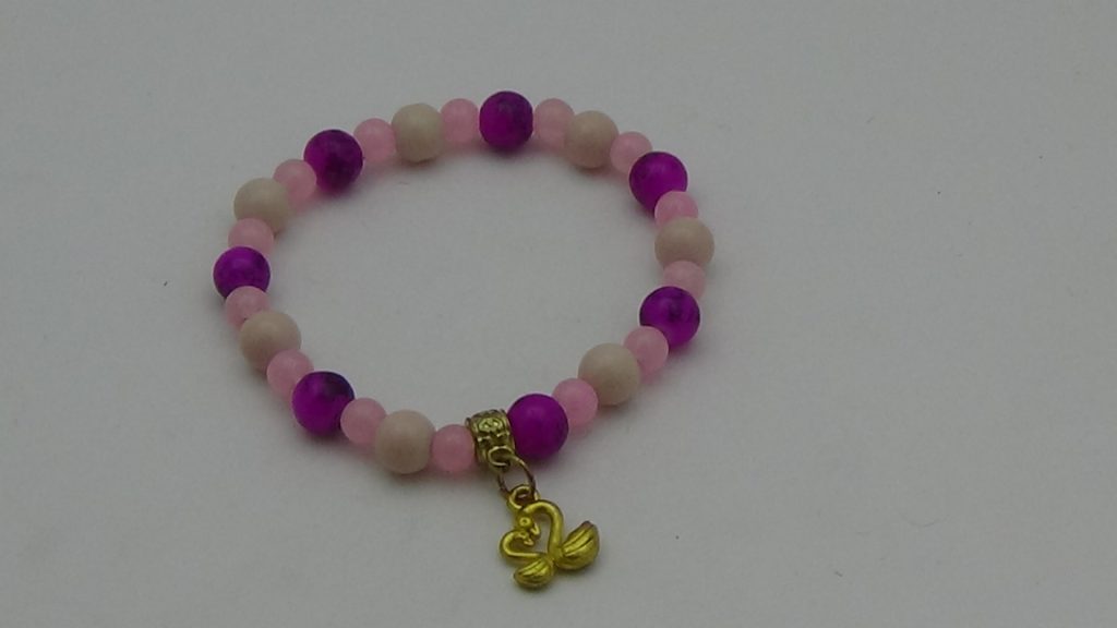 PULSERA DE CRISTAL ROSA CON DIJE DE CISNES (PARA EL AMOR)