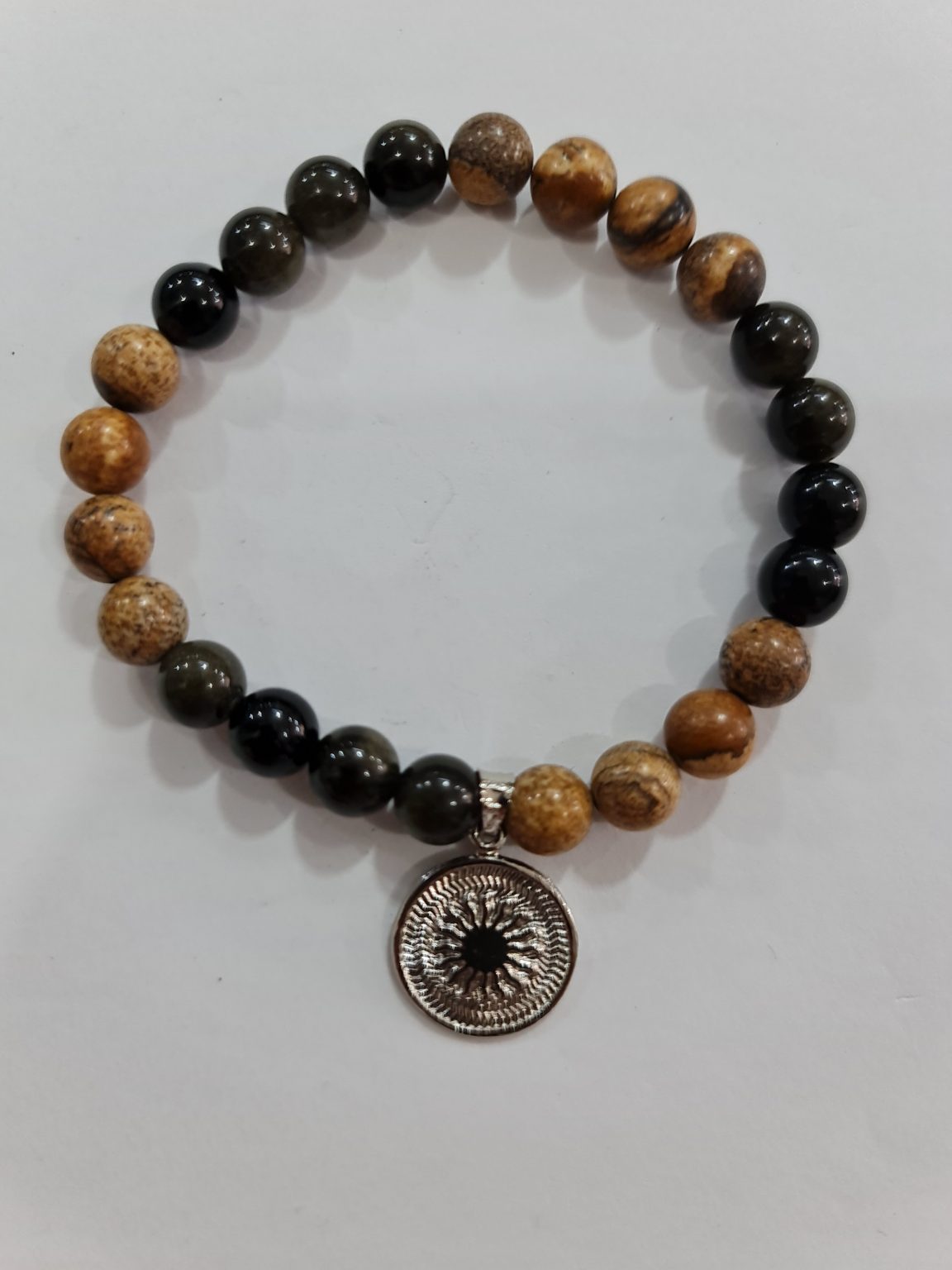 PULSERA DE CUARZO MADERA PETRIFICADA Y CUARZO OBSIDIANA ARCOÍRIS CON DIJE DEL ENEGRAMA SOLAR DE PLATA