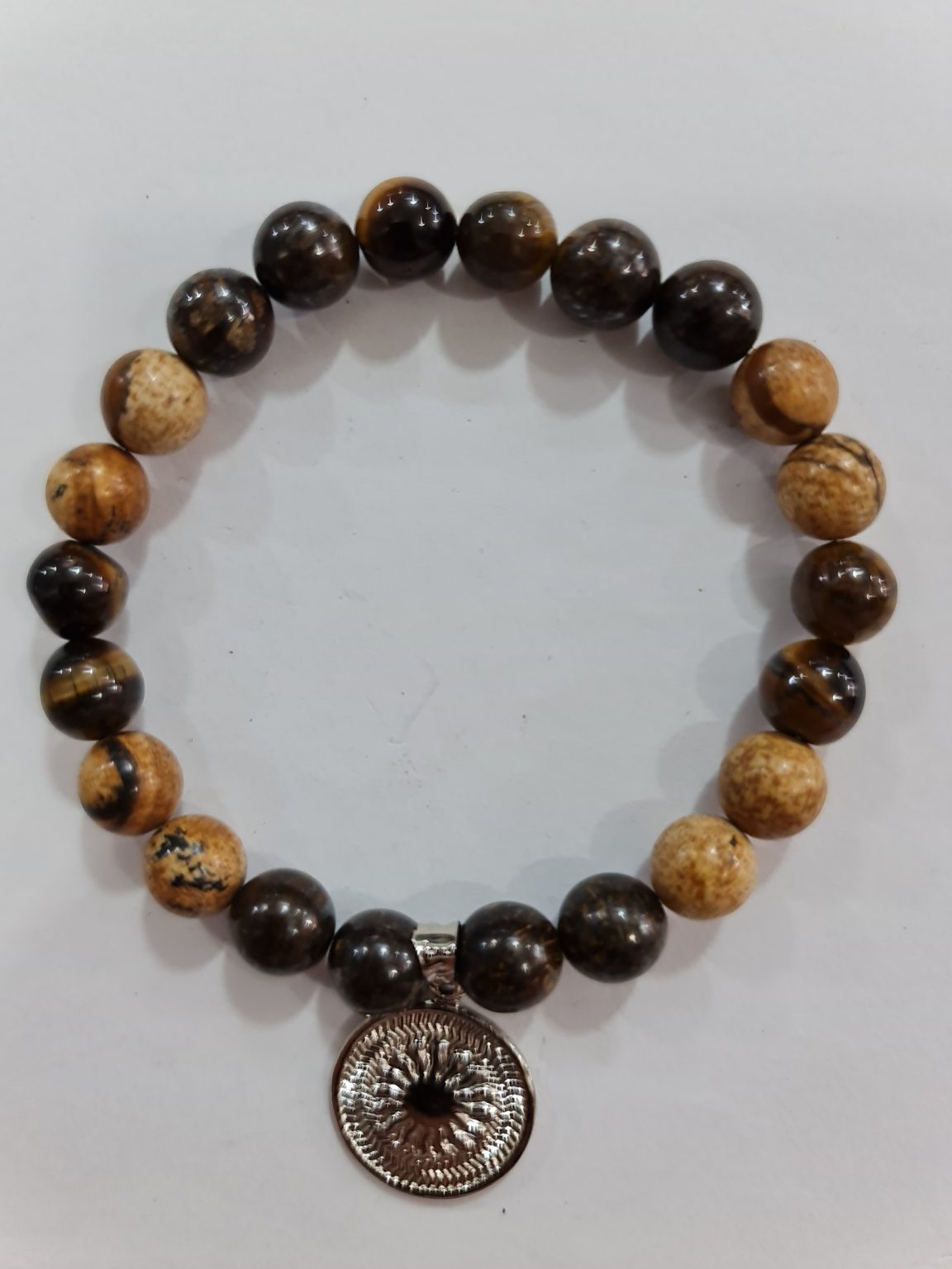PULSERA DE CUARZO MADERA PETRIFICADA Y OJO DE TIGRE CON DIJE DEL ENEGRAMA SOLAR DE PLATA