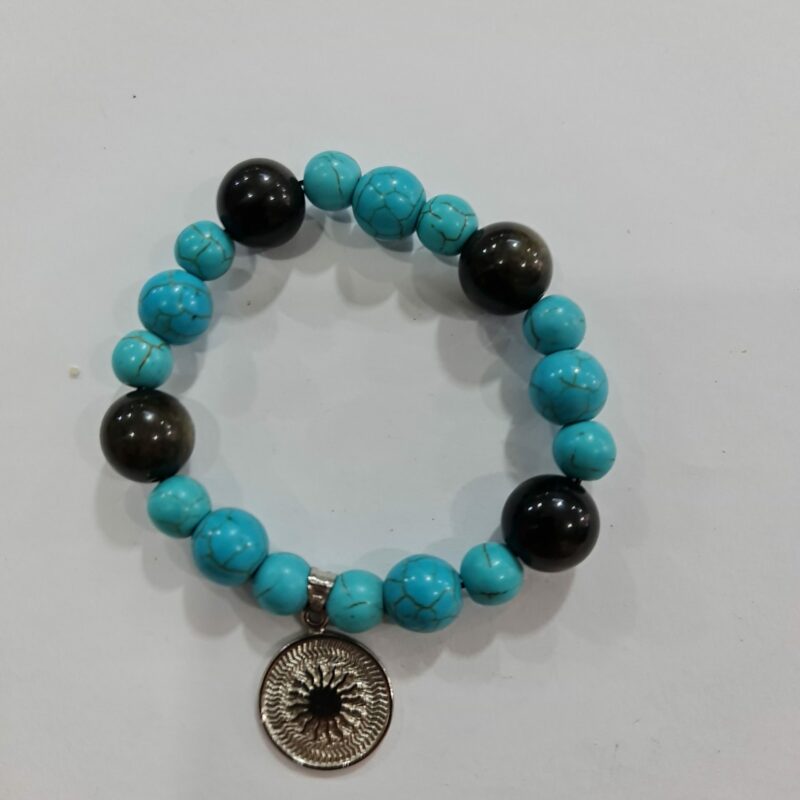 PULSERA DE CUARZO TURQUESA Y CUARZO OBSIDIANA CON DIJE DEL ENEGRAMA SOLAR DE PLATA