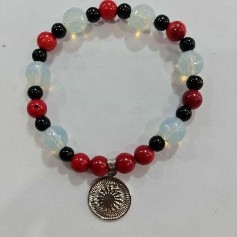 PULSERA DE CUARZO PIDRA LUNA, CUARZO OBASIDIANA Y CUARZO O PIEDRA CORAL CON DIJE DEL ENEGRAMA SOLAR DE PLATA
