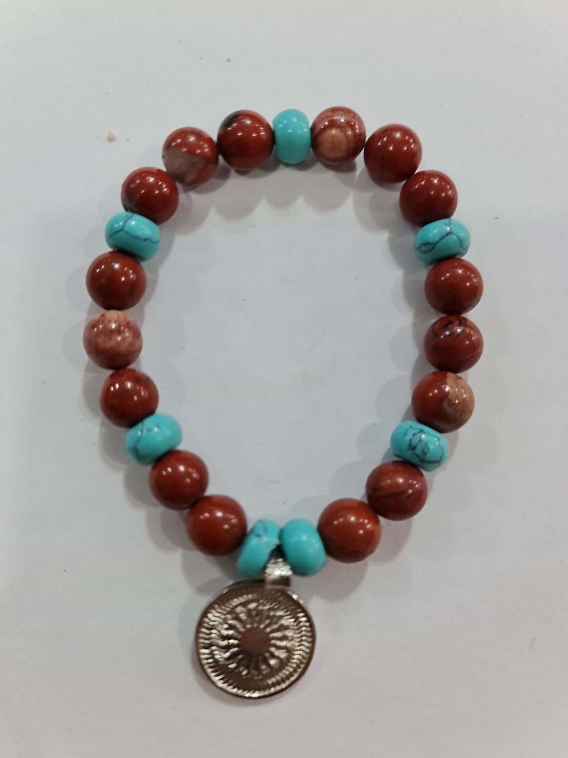 PULSERA DE CUARZO ÁGATA CORNALINA Y CUARZO TURQUESA CON DIJE DEL ENEGRAMA SOLAR DE PLATA
