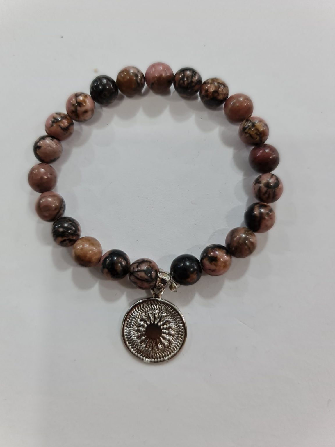 PULSERA DE CUARZO RODONITA CON DIJE DEL ENEGRAMA SOLAR DE PLATA