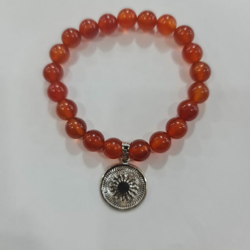 PULSERA DE CUARZO CORNALINA CON DIJE DEL ENEGRAMA SOLAR DE PLATA
