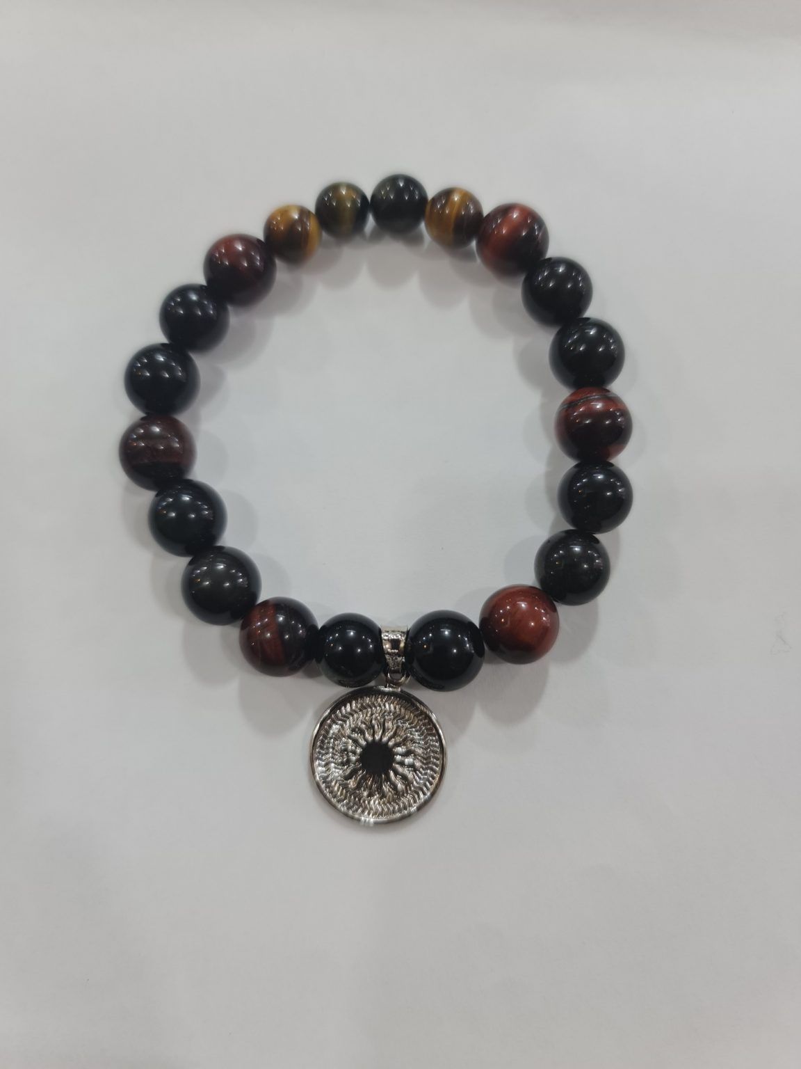 PULSERA DE CUARZO OJO DE GATO Y CUARZO OBSIDIANA CON DIJE DEL ENEGRAMA SOLAR DE PLATA