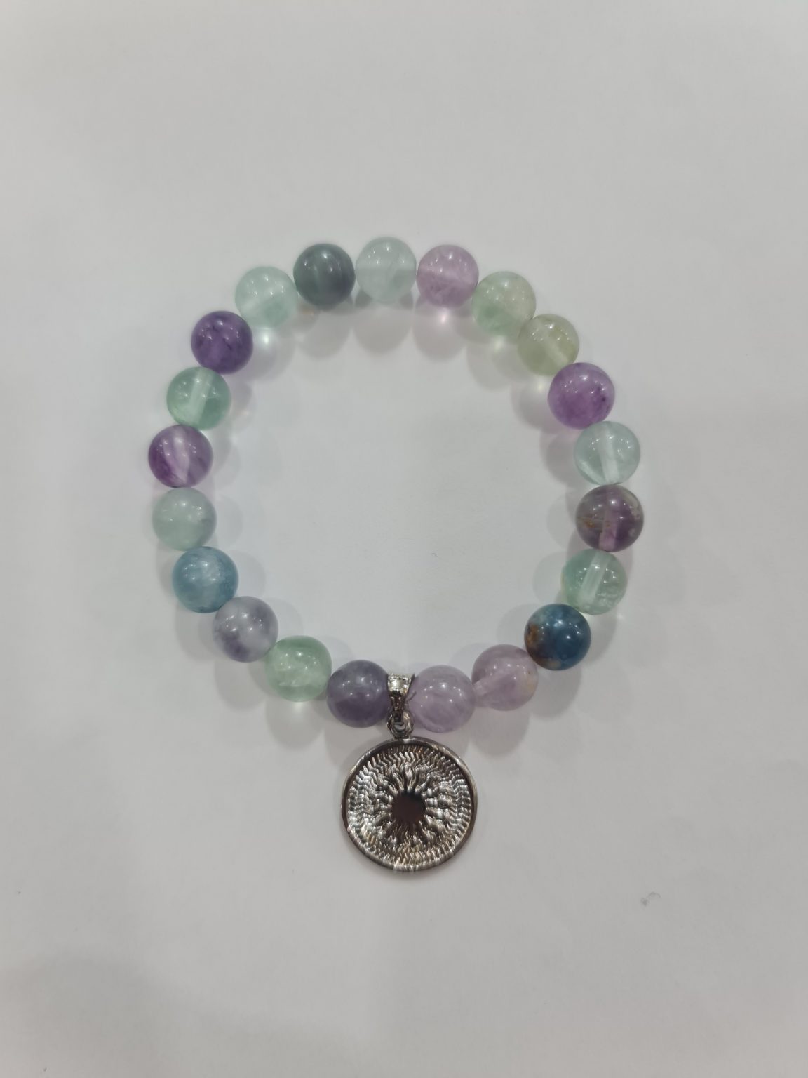 PULSERA DE CUARZO FLOURITA CON DIJE DEL ENEGRAMA SOLAR DE PLATA